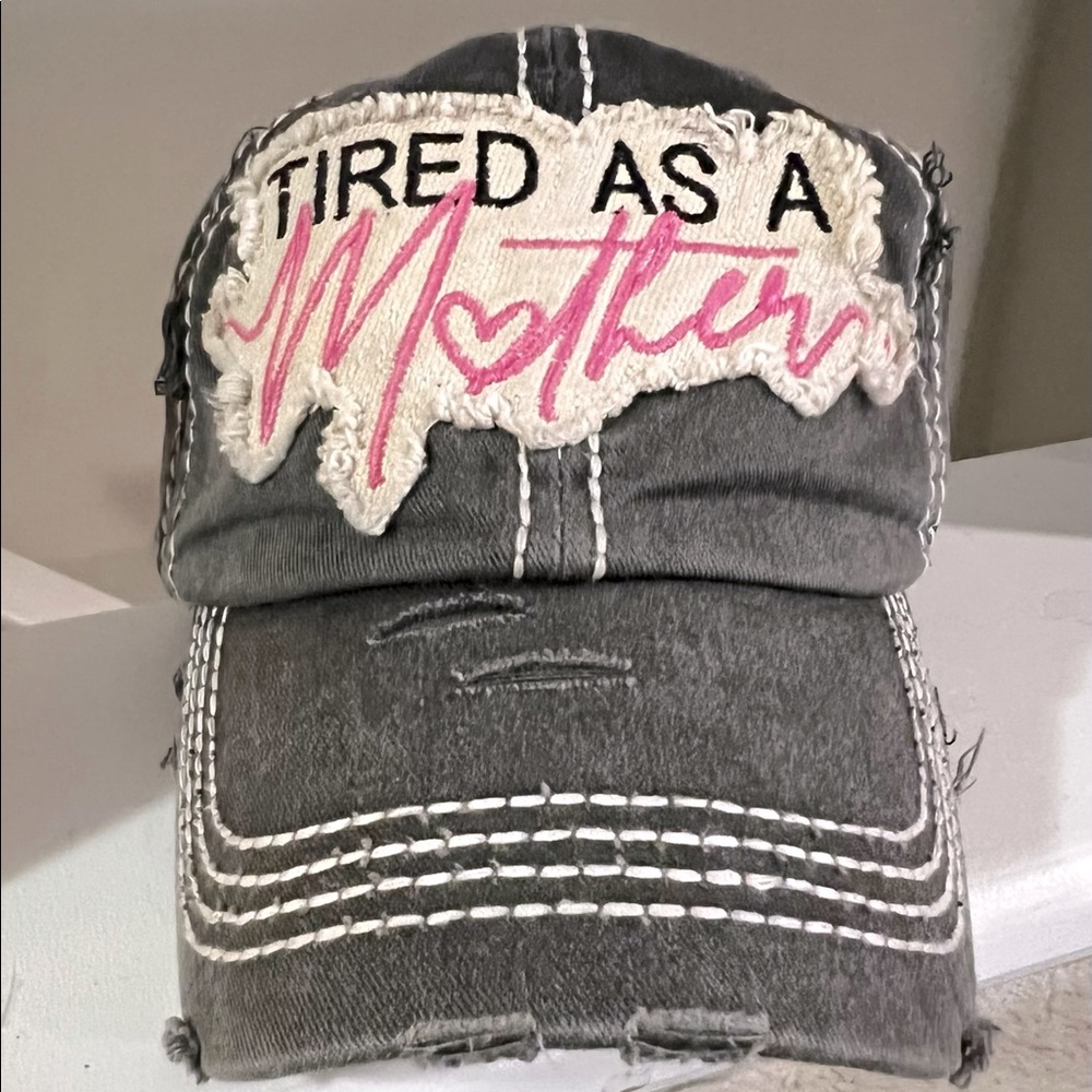 Vintage gray hat w/ivory color stitching . Never worn. "Tired As A Mother "